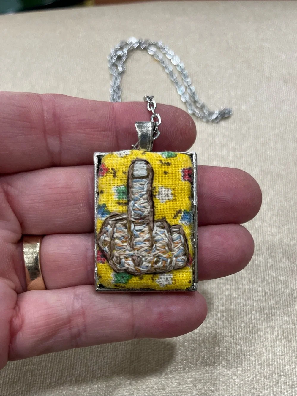 Middle finger hand embroidered pendant and necklace